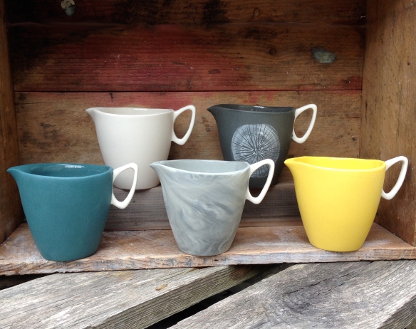 five slip cast jugs